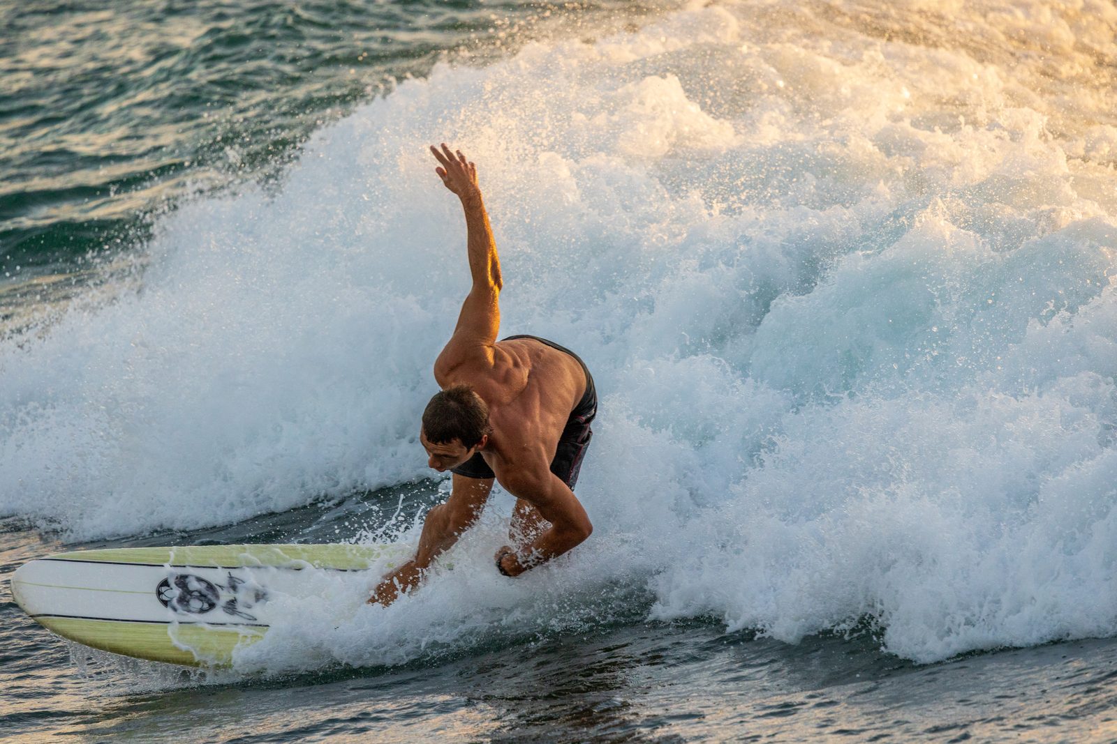Backlit surfer captured at golden hour with Shutr Scout settings